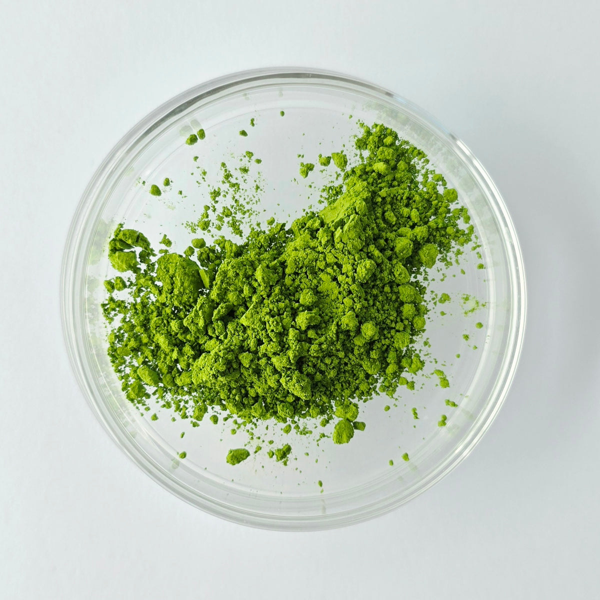 Wabi Matcha Eiko Matcha Green Tea Powder in a glass dish on a white background