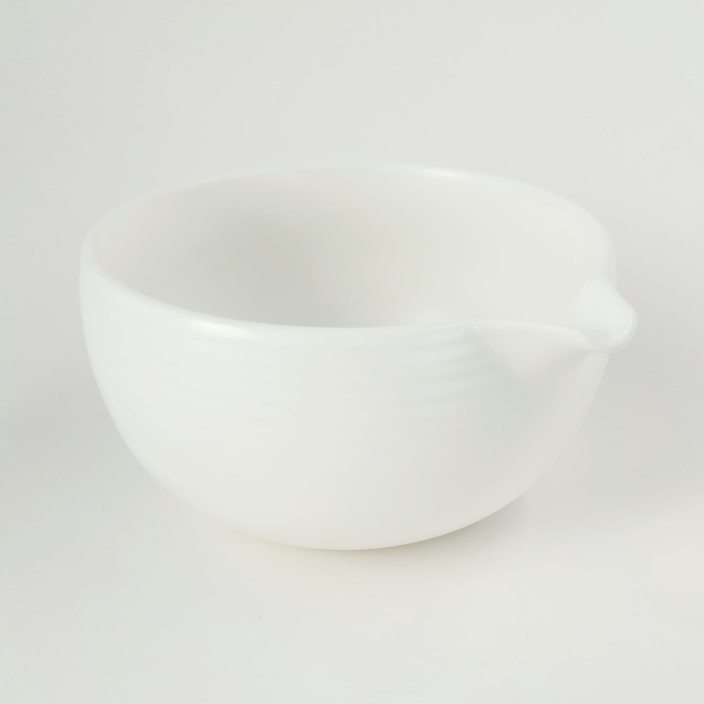 A classic white matcha bowl (chawan) with pourer