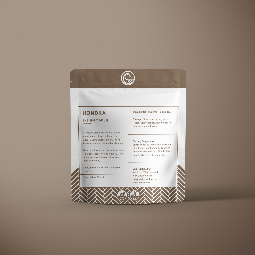 Wabi Honoka Powdered Houjicha Tea 50g Pouch showing the key information and set against a brown background that has a gradient