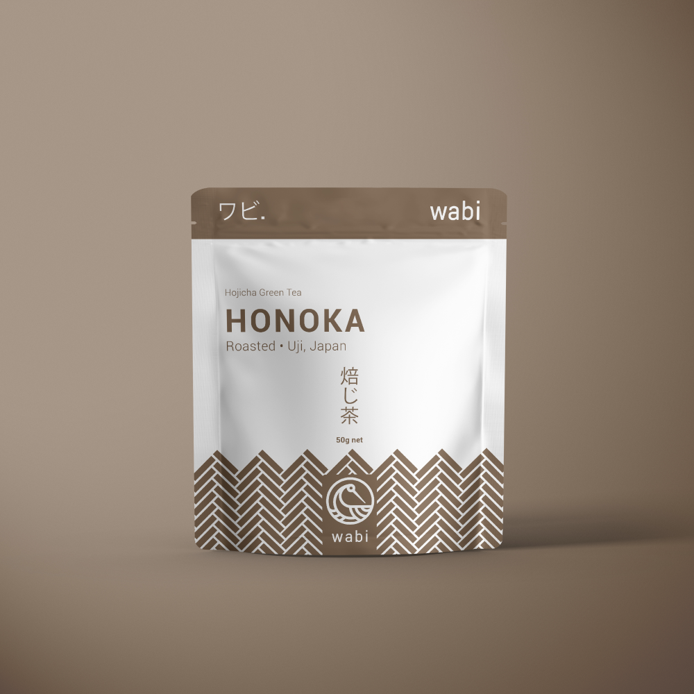Honoka Roasted Houjicha Powder 50g Pouch - Toasty & Aromatic Japanese Green Tea - on a brown background with gradient