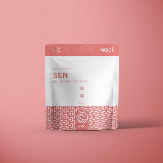 Sen Powdered Sencha Tea 50g Pouch on a pink background- Fresh & Invigorating Japanese Green Tea Powder